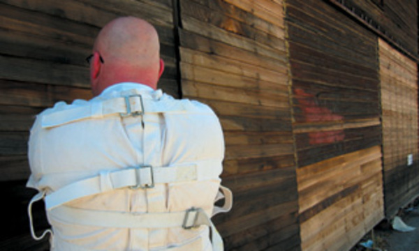 man in straitjacket