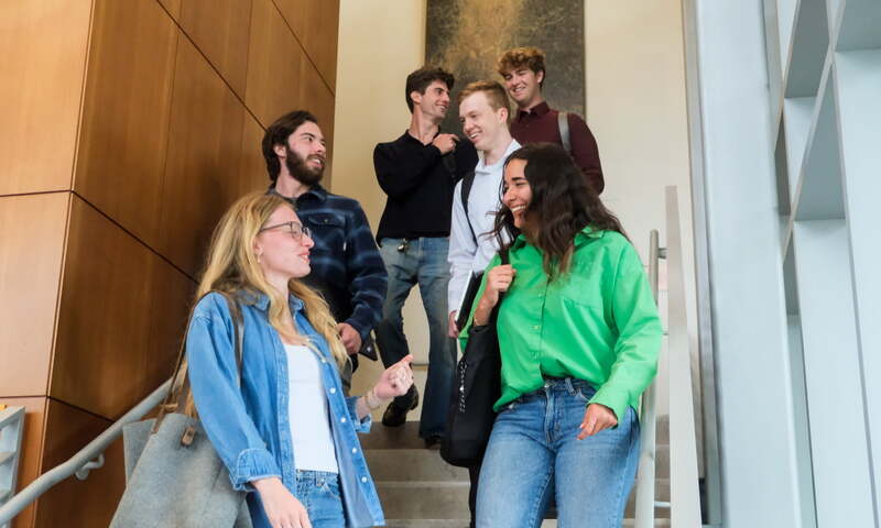 image shows students on stairs