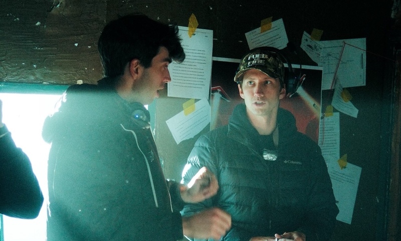 Image shows Nate Norell talking to Dylan Bradshaw on set 