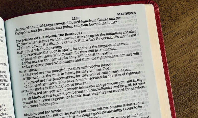 image shows the Bible open to Matthew 5