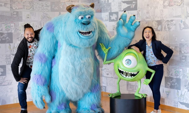 Image shows Hannah with a colleague and Pixar characters
