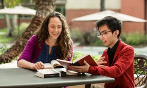 Image shows Torrey Honors professor with a student
