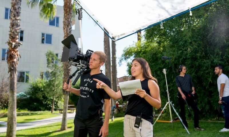 Image shows two film students on a set