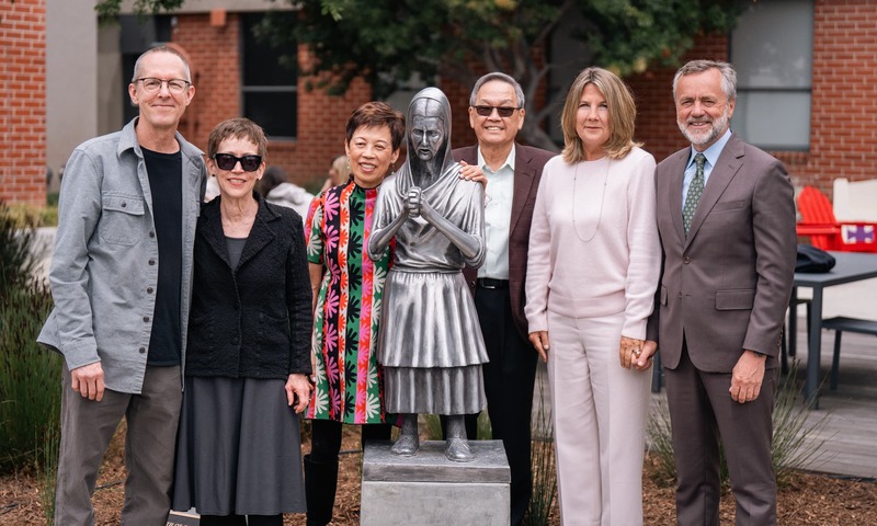 image shows the artist, the donors and the president