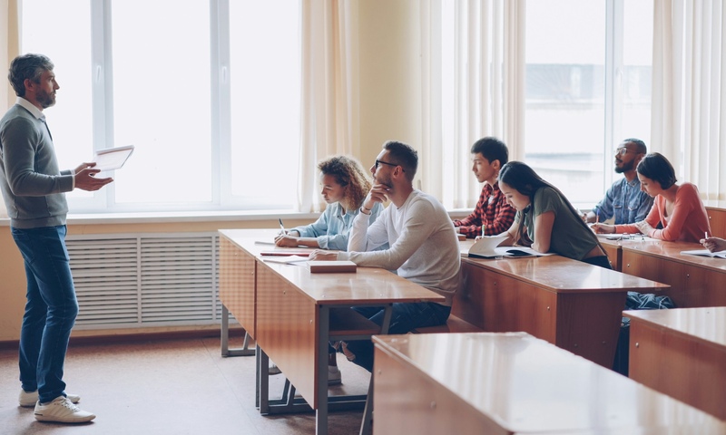 image shows students in a classroom