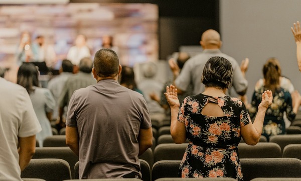 image shows people in church