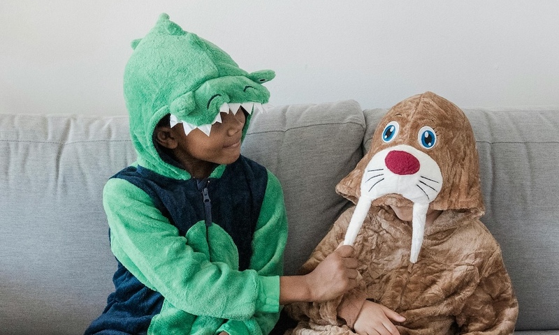 image shows two children in Halloween costumes