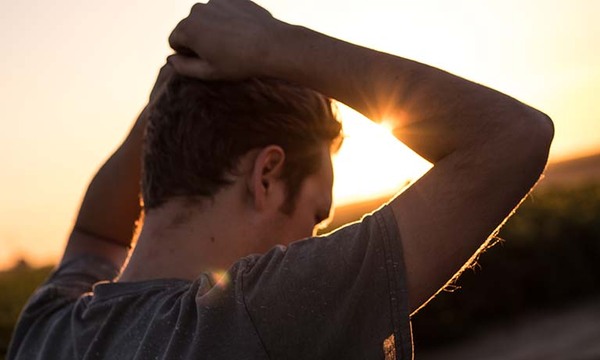 stock image of man grabbing his hair
