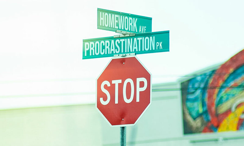 Street signs saying homework and procrastination over a stop sign
