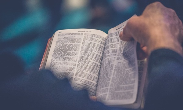 image shows an open Bible