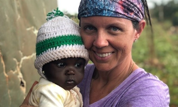 Woman holding small child