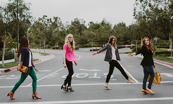 Four women crossing the street