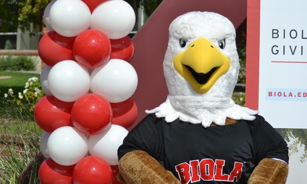 image shows Eddie the Eagle with balloons