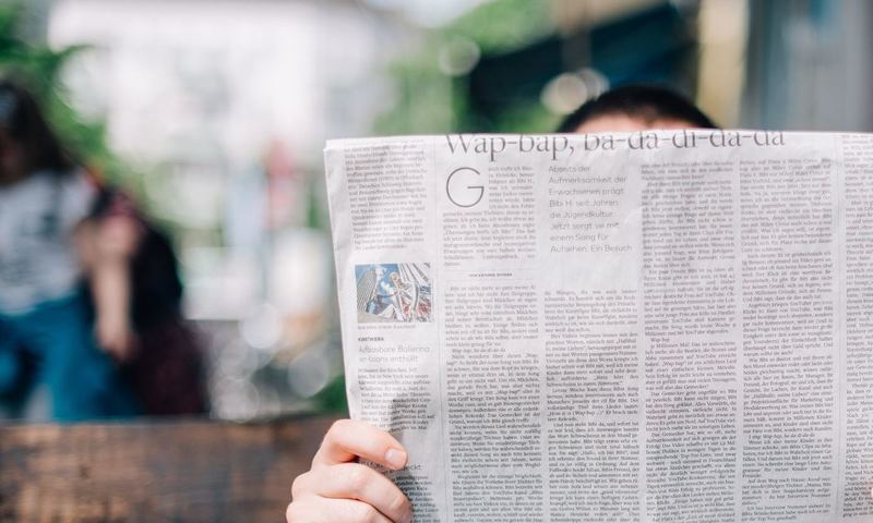 Person reading the newspaper