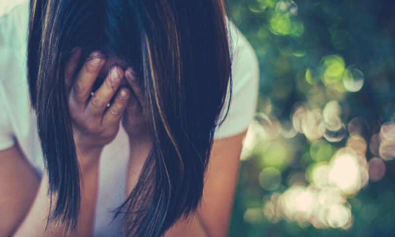a woman with a head in her hands