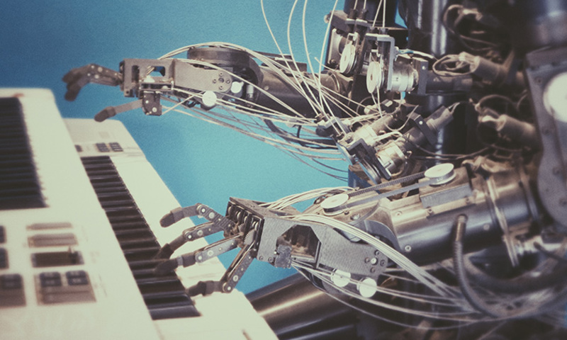 robotic arms playing the keyboard