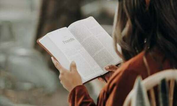 Woman reading the Bible