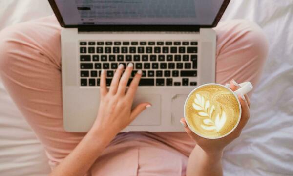 person using laptop on lap