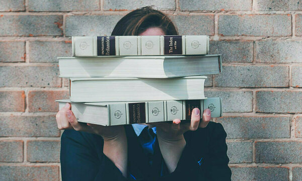 Student with a stack of books