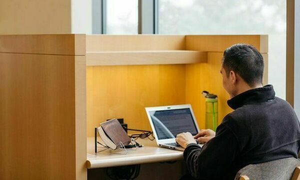 student studying with laptop