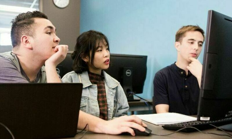 Image shows computer science students collaborating