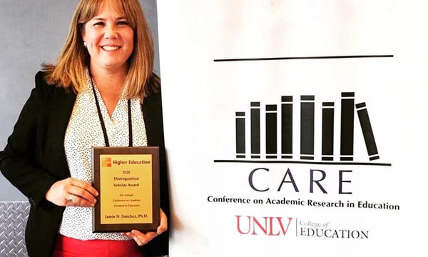 Women holding CARE Award