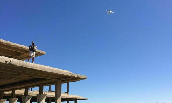 man flying drone