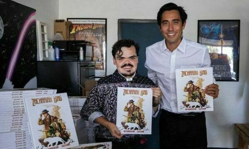 Zach King holding up comic book