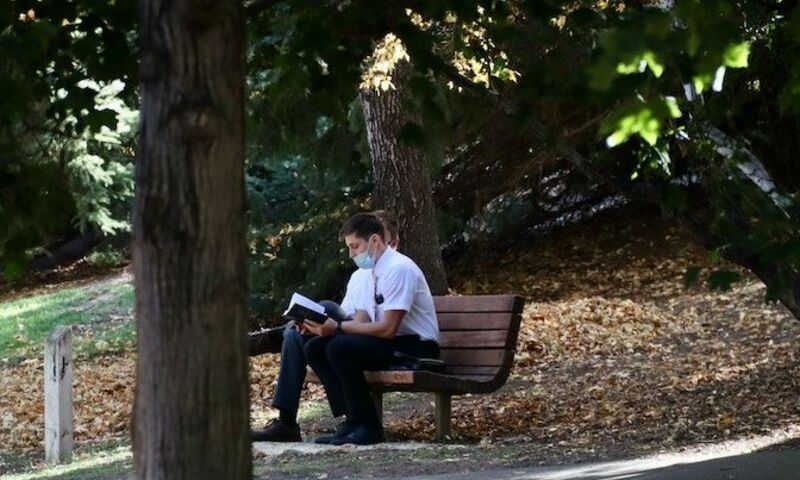 Mormons sitting on bench