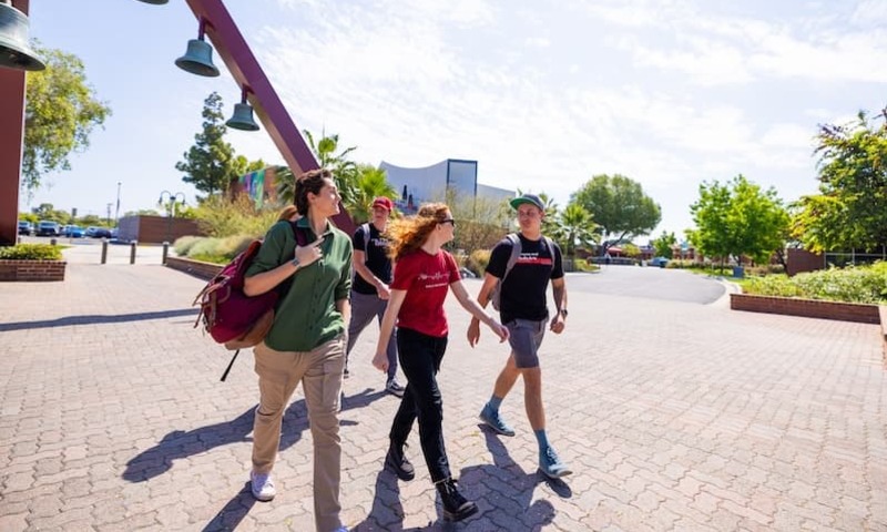 Three Biola students walking on campus