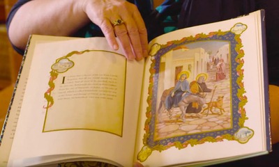 woman holding a picture book