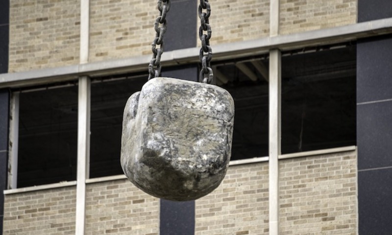 Image shows a stone wrecking ball 