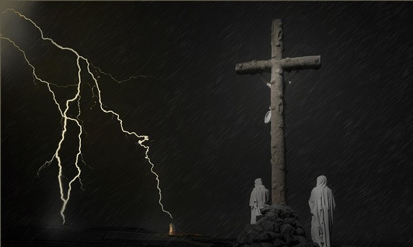 Image shows dark thunderous sky with two onlookers at the cross