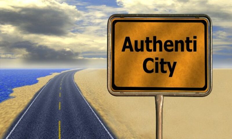 Image shows a highway sign that says "Authenti City"