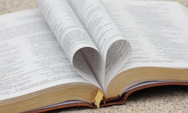 image shows Bible pages making a heart