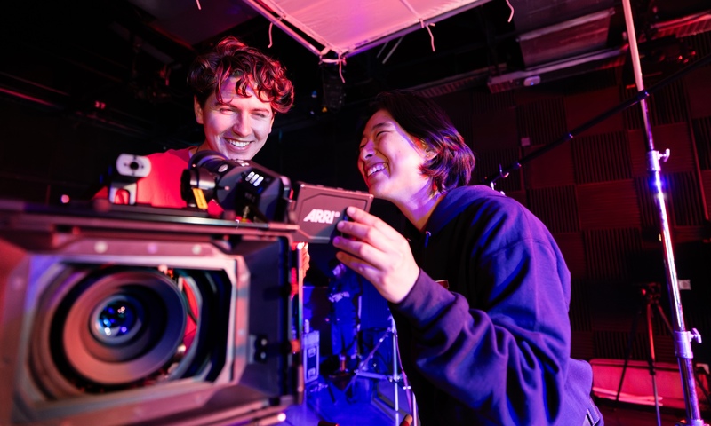 Image shows students with a camera