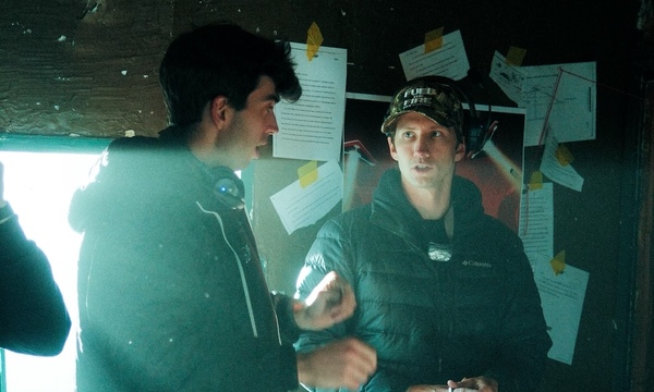 Image shows Nate Norell talking to Dylan Bradshaw on set