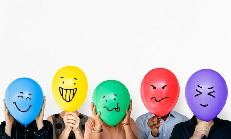 Balloons with drawn-on faces showing emotions