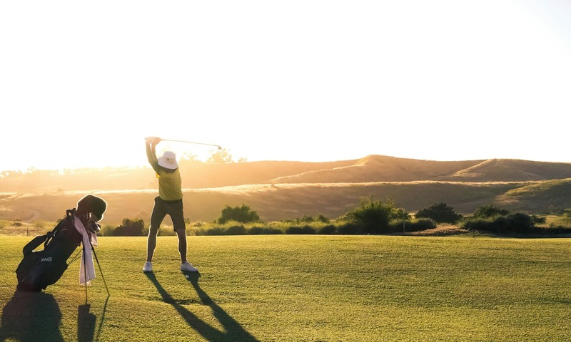 image shows a golfer