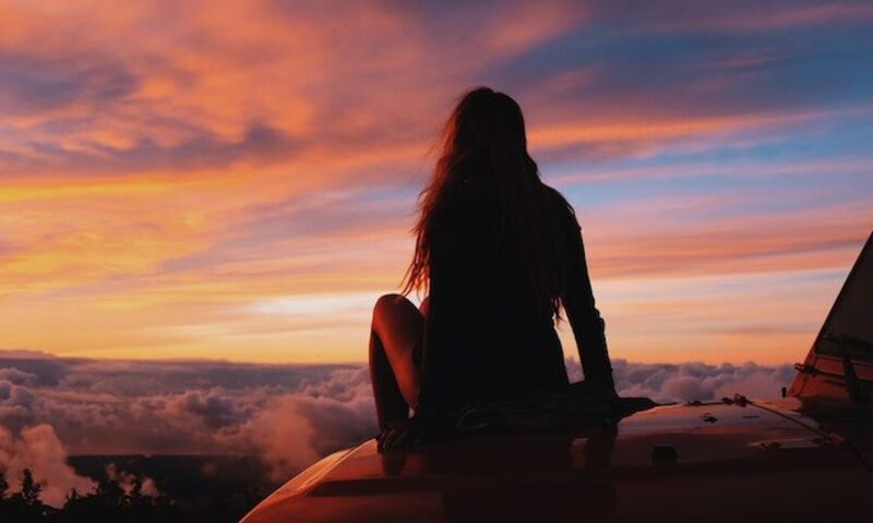 woman staring at sunset