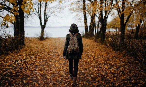 Man Walking in Autumn Forest 