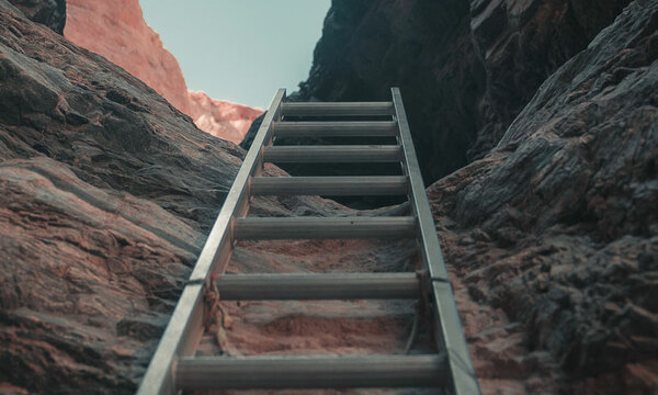 Ladder resting on a mountain