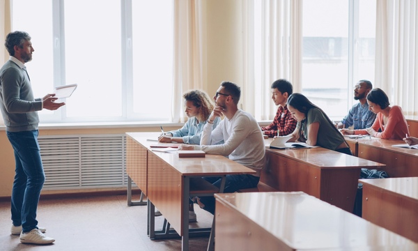 image shows students in a classroom