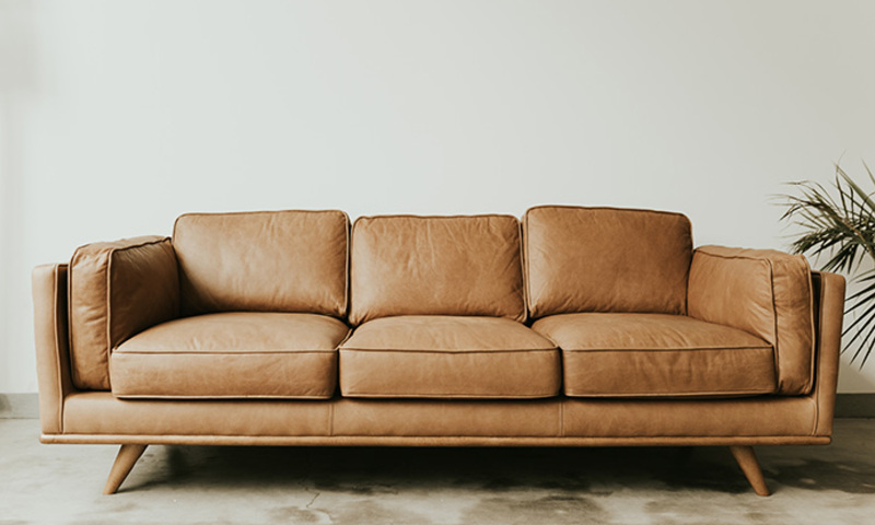 stock image of brown leather couch