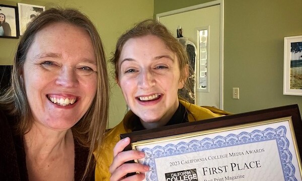 Image shows Tamara Welter and Kate Bomar holding the first place award 