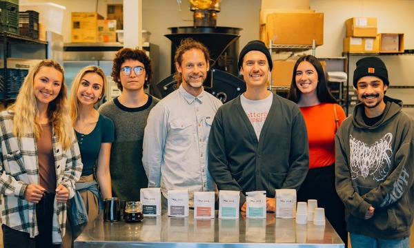 Image shows alumni and students in Rose Park Roasters shop 