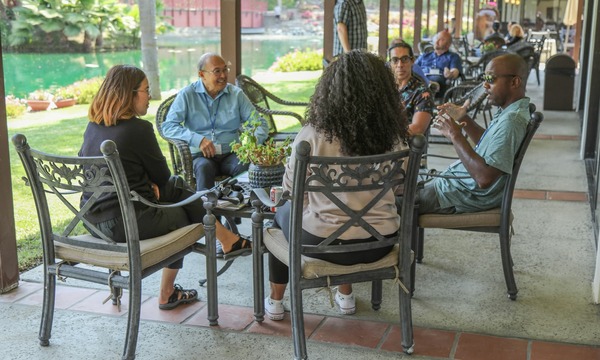 image shows a small group discussion 