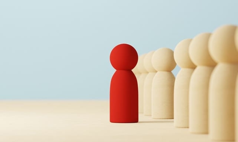 image shows a stand-out figure in a crowd