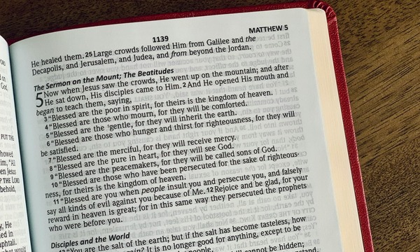 image shows the Bible open to Matthew 5