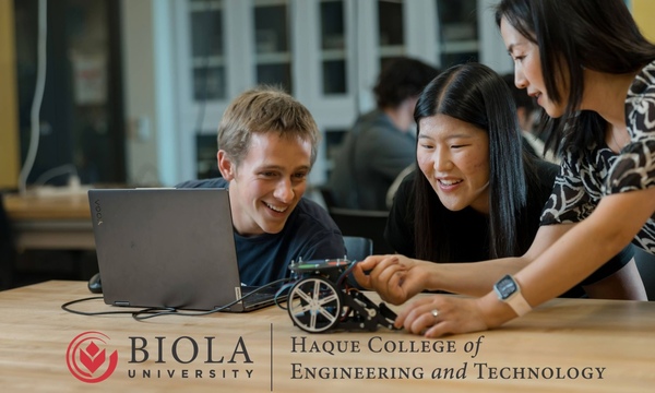 image shows Dr. Grace Ni teaching two students with a robot 